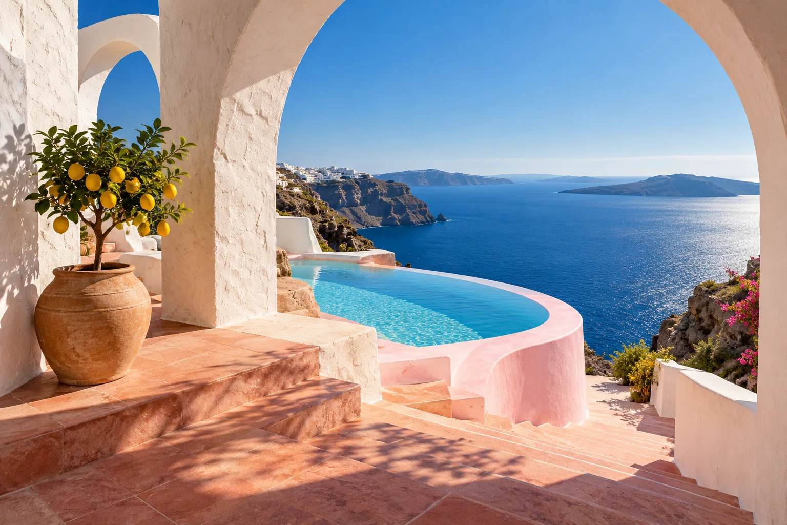 Sunlit Mediterranean arches, a pink pool and deep blue sea